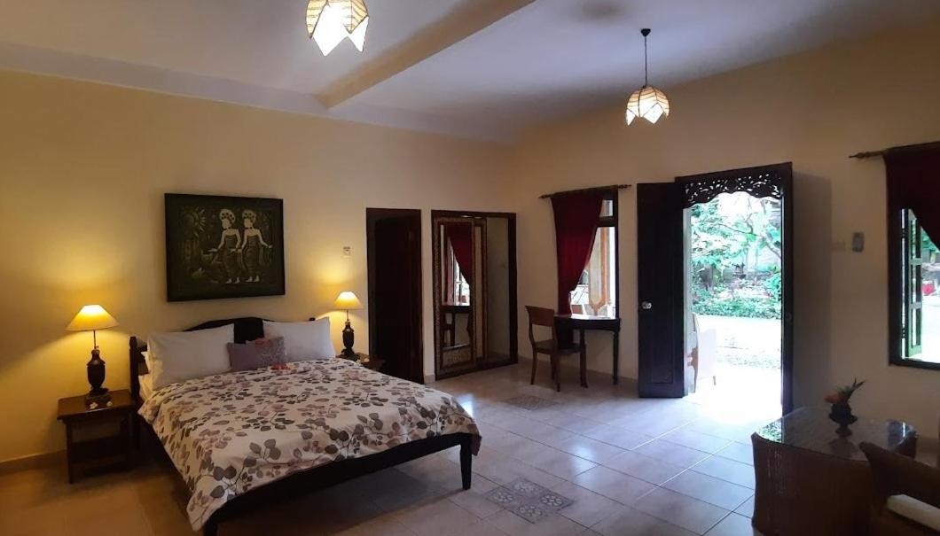 Rambutan Hotel Ловина Экстерьер фото