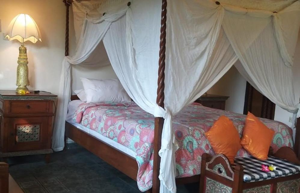 Rambutan Hotel Ловина Экстерьер фото