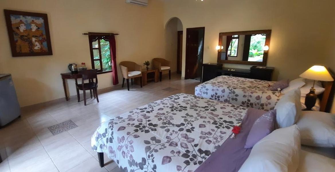 Rambutan Hotel Ловина Экстерьер фото